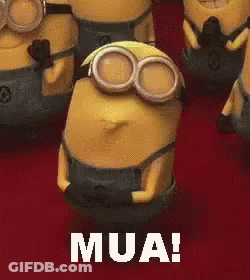 A Group Of Minions Are Standing Next To Each Other And One Of Them Is Wearing Goggles And Saying Mua . GIF