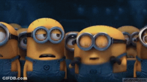 A Group Of Minions Are Standing Next To Each Other With Their Mouths Wide Open . GIF