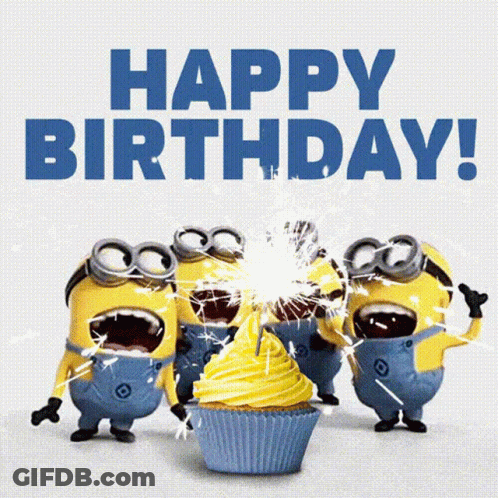 A Group Of Minions Celebrate A Birthday With A Cupcake And Sparklers GIF