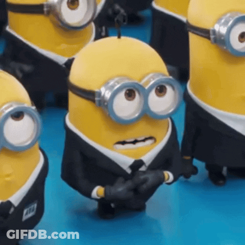 Minions In Suits And Goggles Standing GIF