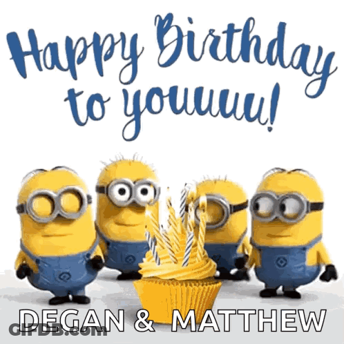A Group Of Minions Standing Around A Cupcake With Candles On It GIF