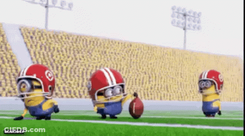 A Group Of Minions Wearing Football Helmets Are Playing A Game Of Football GIF