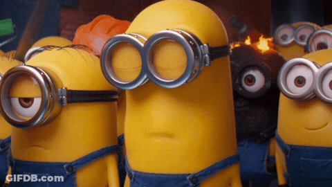 A Group Of Minions Wearing Goggles And Overalls Are Standing Next To Each Other GIF