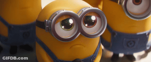 A Group Of Minions Wearing Goggles Are Looking At The Camera GIF