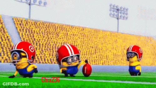 A Group Of Minions Wearing Helmets And Goggles Are Playing Football On A Field GIF