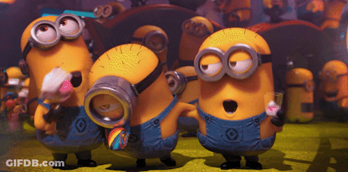 A Group Of Minions With G On Their Overalls Are Standing Together GIF