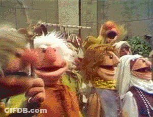 A Group Of Muppets Are Standing In A Room GIF