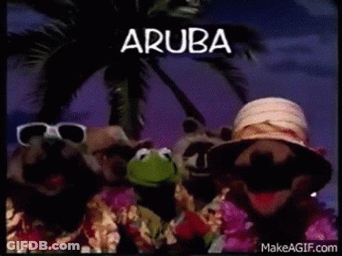 A Group Of Muppets Are Standing Next To Each Other In Front Of A Palm Tree . GIF
