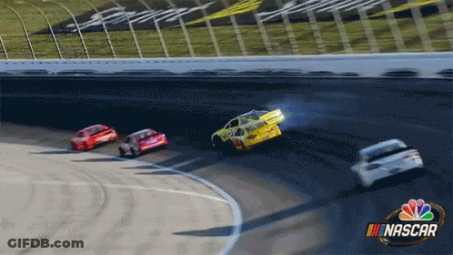 A Group Of Nascar Cars Are Racing Around A Track GIF
