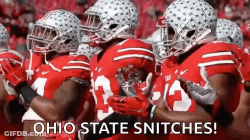 A Group Of Ohio State Football Players Are Standing In A Line . GIF