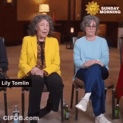 A Group Of Older Women Are Sitting In Chairs In Front Of A Sunday Morning Logo . GIF