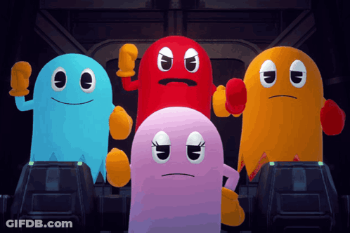 A Group Of Pac Man Ghosts Standing Next To Each Other In A Dark Room GIF
