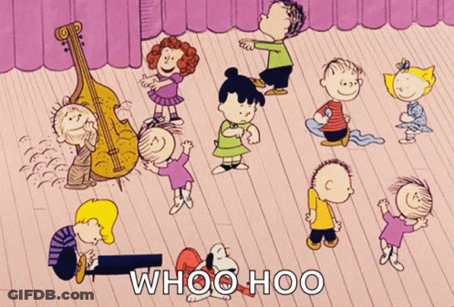 A Group Of Peanuts Characters Are Dancing On A Stage GIF