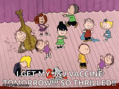 A Group Of Peanuts Characters Are Dancing On A Stage With A Cello In The Background . GIF