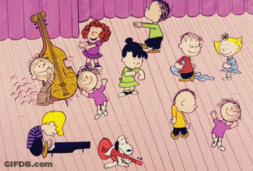 A Group Of Peanuts Characters Are Dancing On A Wooden Floor GIF
