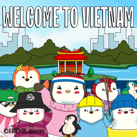 A Group Of Penguins Are Standing In Front Of A Welcome To Vietnam Poster GIF