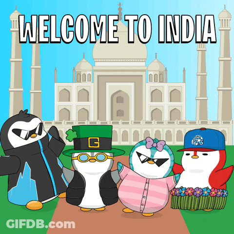 A Group Of Penguins Standing In Front Of The Taj Mahal With The Words Welcome To India Written On The Bottom GIF