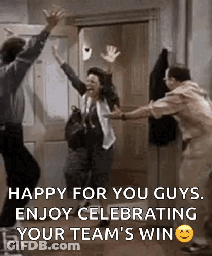 A Group Of People Are Celebrating A Team 'S Win In A Room . GIF