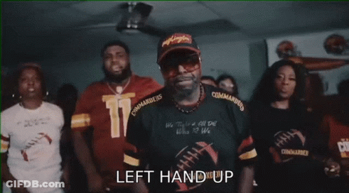 A Group Of People Are Cheering With The Words " The Commanders " Written On The Bottom GIF