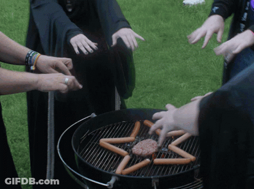 A Group Of People Are Cooking Hot Dogs And A Hamburger On A Grill In The Shape Of A Pentagram GIF