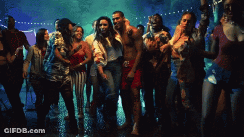 A Group Of People Are Dancing At A Party And One Of Them Is Wearing A Shirt That Says ' Calvin Klein ' GIF