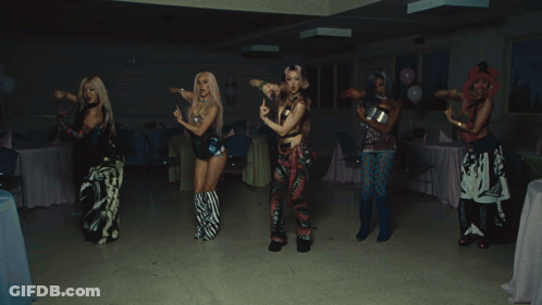A Group Of People Are Dancing At A Party With A Bag That Says Hawaii On It GIF