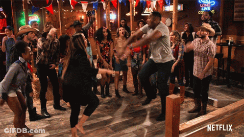 A Group Of People Are Dancing In A Bar With A Netflix Logo In The Corner GIF