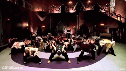 A Group Of People Are Dancing In A Circle With The Word Vevo On The Bottom Right GIF