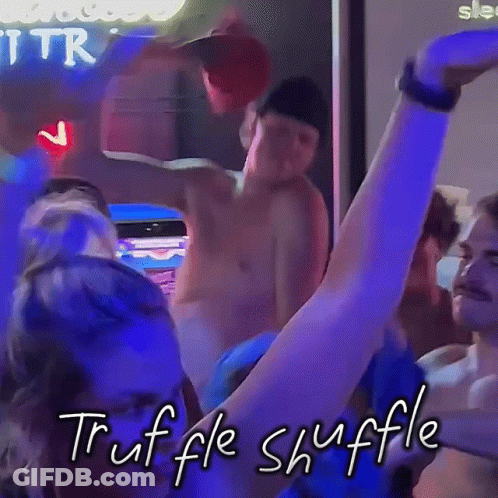 A Group Of People Are Dancing In A Dark Room And The Words Truffle Shuffle Are Written On The Bottom GIF