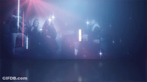 A Group Of People Are Dancing In A Dark Room With The Letter I In The Background GIF