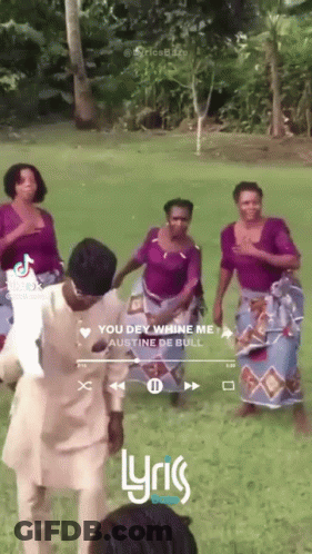 A Group Of People Are Dancing In A Field And The Song Is You Dey Whine Me GIF
