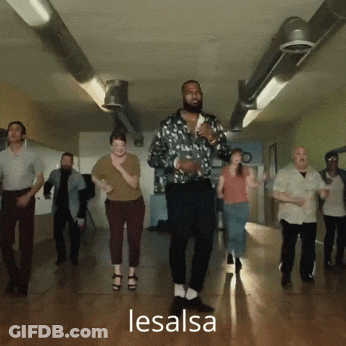 A Group Of People Are Dancing In A Hallway And The Word Lesalsa Is On The Bottom Right GIF