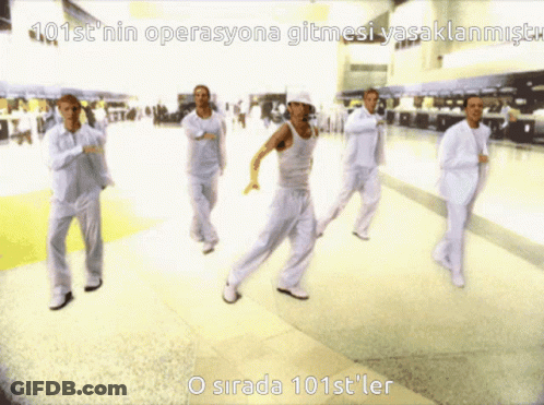 A Group Of People Are Dancing In A Hallway With The Words 101St ' Nin Operasyona Gitmesi Yasaklanmistr GIF