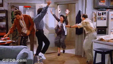 A Group Of People Are Dancing In A Living Room In A Living Room . GIF
