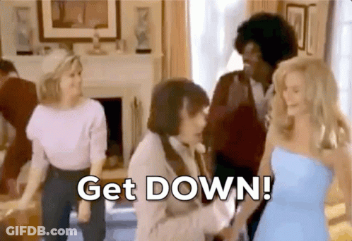 A Group Of People Are Dancing In A Living Room With The Words Get Down Written On The Screen GIF