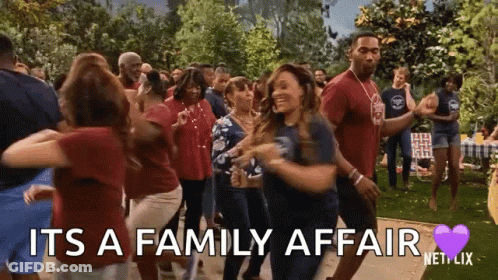 A Group Of People Are Dancing In A Park With The Words `` It 'S A Family Affair '' Written On The Screen . GIF