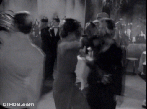 A Group Of People Are Dancing In A Room GIF