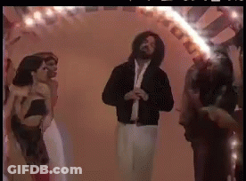A Group Of People Are Dancing In A Room With A Fire Coming Out Of Their Mouths GIF