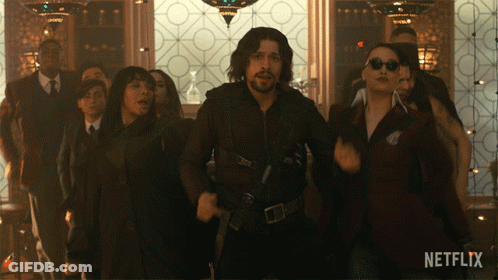 A Group Of People Are Dancing In A Room With A Netflix Logo On The Bottom GIF