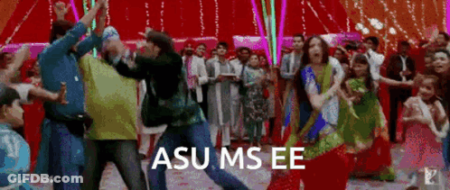 A Group Of People Are Dancing In A Room With A Sign That Says Asu Ms Ee GIF
