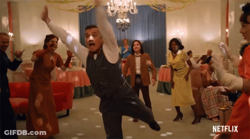 A Group Of People Are Dancing In A Room With Netflix Written On The Bottom GIF