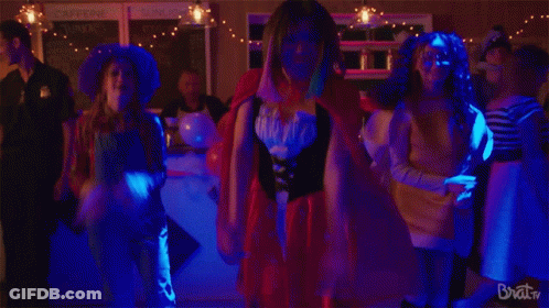 A Group Of People Are Dancing In A Room With The Words Brat TV On The Bottom Right GIF