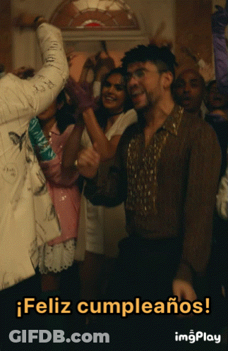 A Group Of People Are Dancing In A Room With The Words Feliz Cumpleanos In The Bottom Right Corner GIF