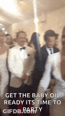 A Group Of People Are Dancing In A Room With The Words `` Get The Baby Oil Ready It 'S Time To Party '' . GIF