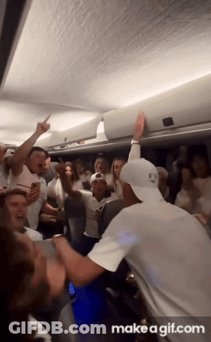 A Group Of People Are Dancing In A Room With The Words Make A Gif.com At The Bottom Of The Screen GIF
