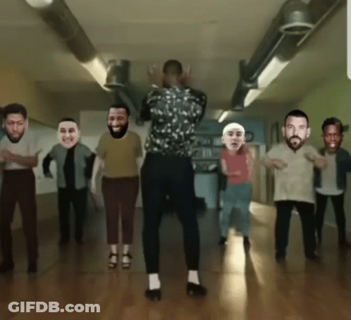 A Group Of People Are Dancing In A Room With Their Faces On Them GIF