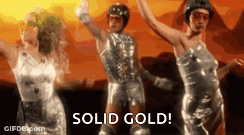 A Group Of People Are Dancing In A Video With The Words Solid Gold . GIF