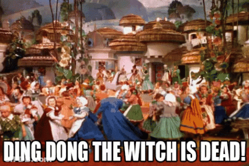 A Group Of People Are Dancing In A Village With The Words Ding Dong The Witch Is Dead GIF