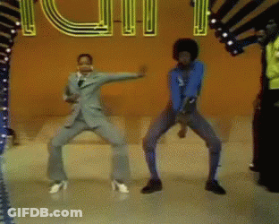 A Group Of People Are Dancing In Front Of A Neon Sign That Says Youth GIF