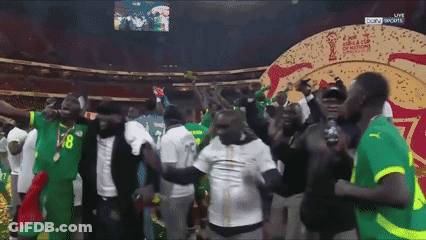 A Group Of People Are Dancing In Front Of A Screen That Says Sky Sports GIF